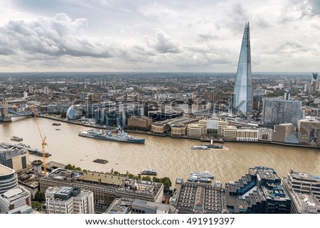 Beautiful London skyline at dusk over Thames river, aerial view.