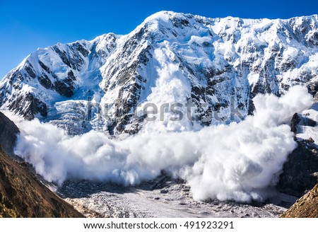 Power of nature. Real huge avalanche comes from a big mountain, Shkhara, 5.193 m, Caucasus, Kabardino-Balkaria, Bezengi region, Russia Royalty-Free Stock Photo #491923291