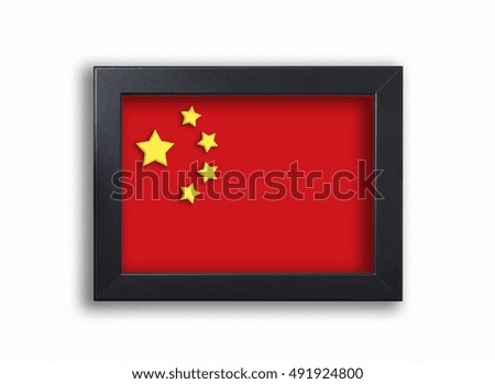 Chinese flag in black photo frame on white backgorund