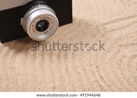 retro camera on the sand