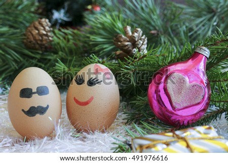 Lovers, New year and Christmas is celebrated . Unusual eggs with the muzzle. The love of two eggs.