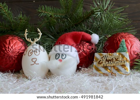 Santa Claus and Christmas deer on New year and Christmas .Unusual eggs with the faces ,muzzle.Christmas cartoon,  decorations.Eggs with faces on Christmas and new  2017 year.