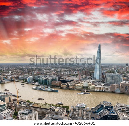 Beautiful London skyline at dusk over Thames river, aerial view.