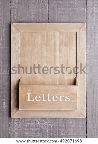 Wooden textured  board for letters and messages on wooden background