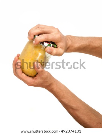 Hands open the jar isolated on white background . Royalty-Free Stock Photo #492074101