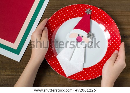 Creating a Christmas decoration for table setting. Decor for serviette in form of Santa Claus. Children project, step by step photo instructions. Step 10. Decor for serviette on a plate