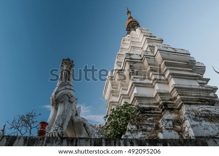 A temple in Chiang Mai with a sculpture, Thailand. Big and beautiful piece of ancient architecture in Thailand. Beautiful travel picture of Asia.