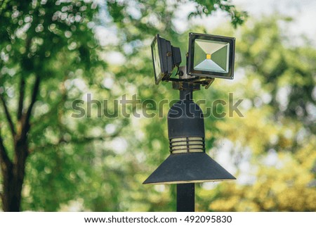 The lamp LED in the park,blur Garden background.