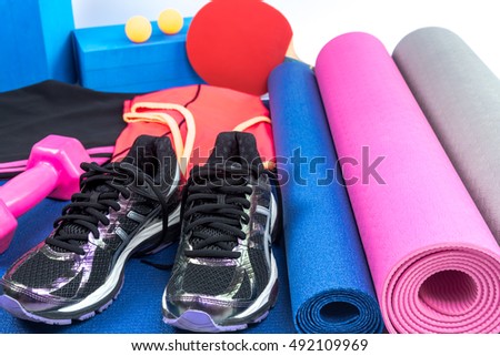 Still life of sport equipment on yoga mat / healthy lifestyle conceptual