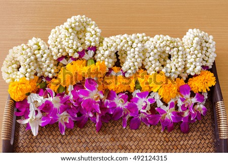 Thai Flower Garland with jasmine & roses on both hands put together as sign of respect & honour (flower garland is widely given on Songkran festival & Mother's day in Thailand)