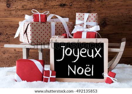 Sleigh With Gifts On Snow, Joyeux Noel Means Merry Christmas