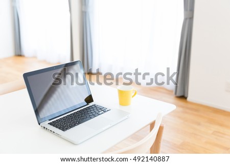 laptop computer on table in living room