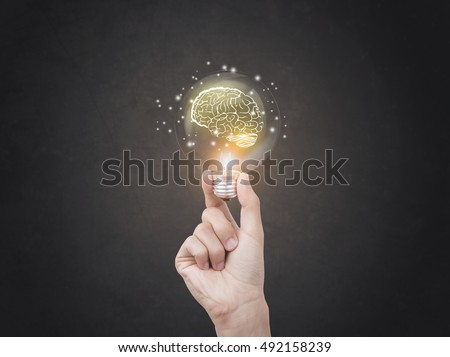 lightbulb brainstorming creative idea abstract icon on business hand.  Royalty-Free Stock Photo #492158239