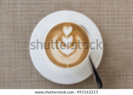 Defocused and blurred image for background of latte art heart shape