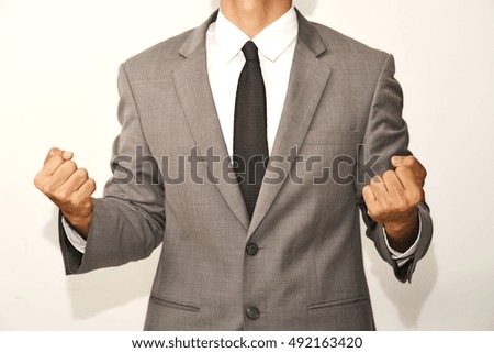 Businessman feeling strong over white background