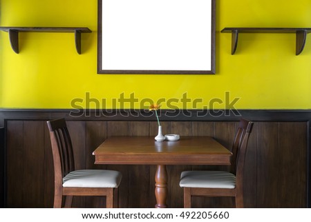 Luxury restaurant set with yellow color wall with big photo frame, decorate concept