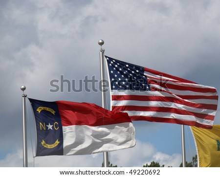 American and North Carolina flags blowing in the breeze.