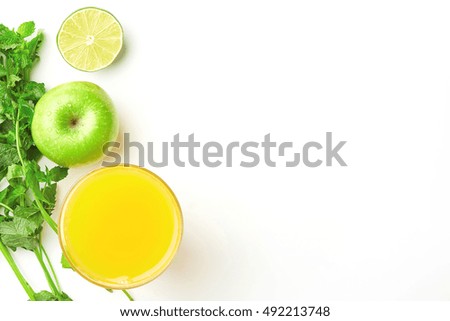 Detox food & drink healthy lifestyle concept: Fresh organic vegetables fruit herbs & spices. Orange juice aoole lime & mint herbs. White paper background. Free space text layout Top view