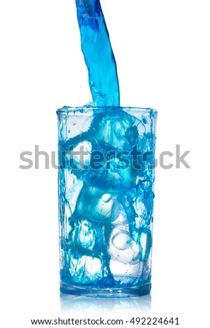 pouring blue water splash into glass isolated on white background with clipping path