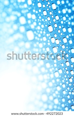 Blue water drops of on treat water-repellent surface in macro lens shot small-DOF for screen wallpapers