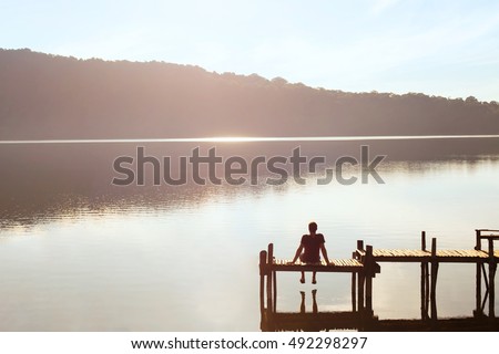 happy people, daydreamer, man enjoying beautiful view of the lake, inspiration in nature Royalty-Free Stock Photo #492298297