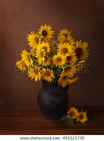 Sunflowers on old wooden table.