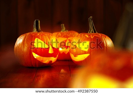 photo of halloween time and orange pumpkins on desk space 