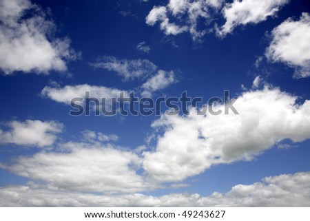 White fluffy clouds in blue sky