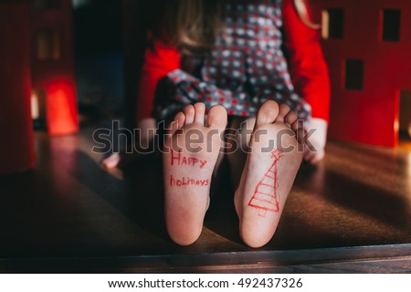 baby bare feet on the wooden floor. Christmas celebration concept
