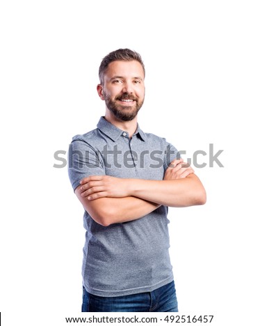 Hipster man in gray t-shirt, studio shot, isolated