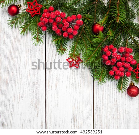 christmas fir tree with decoration on a wooden board