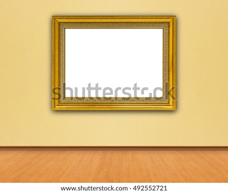 Retro golden frame on the yellow wall, copy space