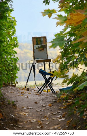 easel on a path of the autumn park