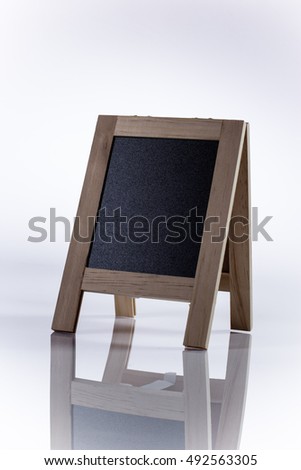 the small desktop blackboard on white background