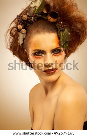 Beauty studio shot redhead woman in autumn makeup