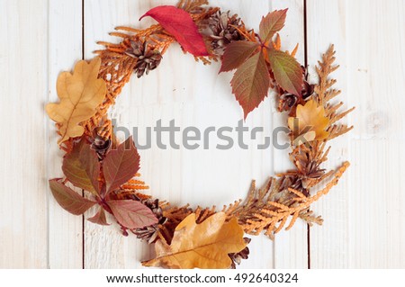 frame wreath vignette from dry branches of a thuja fall autumn background