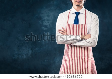 Businessman wearing an apron