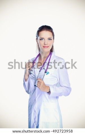Smiling female doctor in uniform standing at hospital