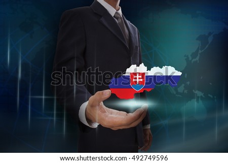 Businessman showing map of Slovakia on globe background