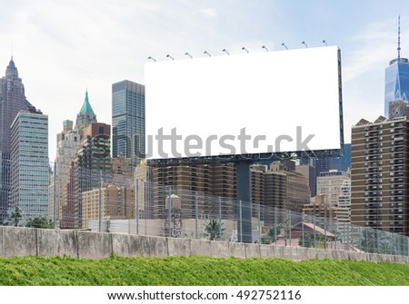 Mock up of blank billboard advertising in the city With clipping path on screen.- can be used for display your products or promotional.