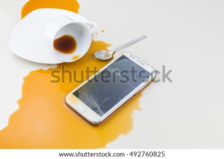Smart phone dropped coffee spilled on white background

