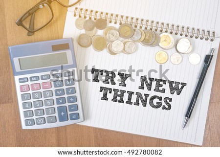 TRY NEW THINGS A finance Money, calculator notes, calculator top view with work