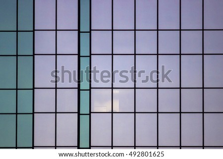 Close Up of Pastel Colored Skyscraper Windows Reflecting Twilight Colors