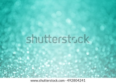 Abstract teal turquoise and mint aqua green glitter sparkle background or party invitation design Royalty-Free Stock Photo #492804241
