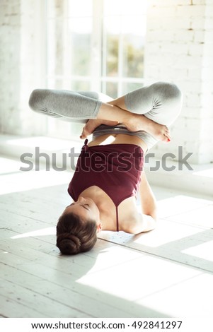 Skillful professional female dancer training her body