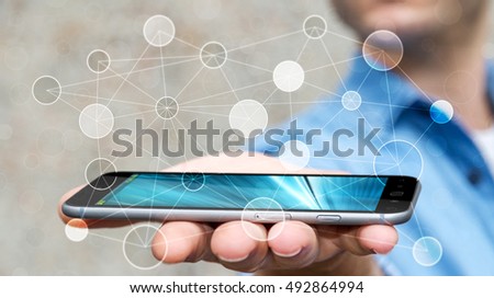Businessman on blurred background using circle igital data network with mobile phone 3D rendering