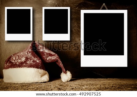 Christmas cards, vintage Santa hat with empty picture frame for put three photos