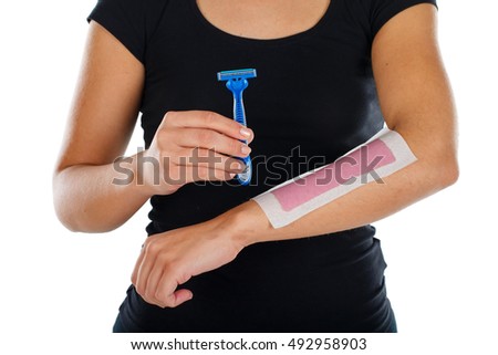 Picture of a woman standing on an isolated background while shaving
