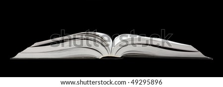 Open book isolated on a black background.