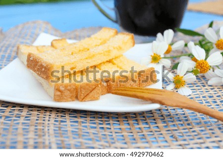 Baked bread butter placed on a wooden floor.
